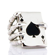 A solid sterling silver Ace of Spades ring, featuring a detailed and powerful skeleton hand gripping the iconic card.