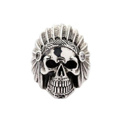 A massive, solid sterling silver American Indian chief skull ring with a full, intricately detailed feathered headdress.