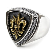 An angled view of the fleur de lis biker ring showing the 14K gold plating and CZ stones.