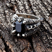 Top view of the black gothic claw ring, showing dragon talons gripping a square black stone.