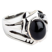 Front angled view of the Black Onyx Rocker Ring featuring a polished flat black stone set in a wide sterling silver frame.
