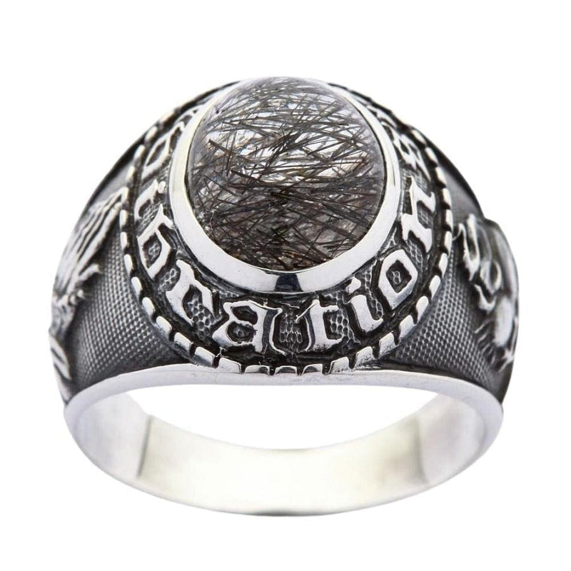 Anillo de plata de ley con cuarzo rutilado negro y grabados de Sagrado Corazón y manos en oración, vista frontal