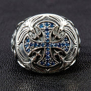 Top view of the Knights Templar cross ring showing pave-set blue sapphire CZ stones and floral silver carvings