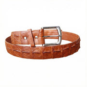 Close up of silver buckle on cognac brown crocodile skin belt