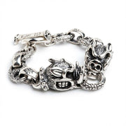 Front view detail of the wild pig snout and textured silver scales on a gothic men's bracelet.