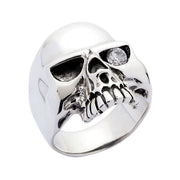 A highly polished sterling silver skull ring with a single brilliant clear diamond CZ stone in one eye.