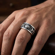 Man wearing diamond tribal sterling silver band ring on hand