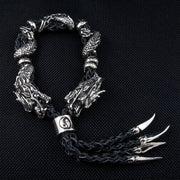 Two 925 sterling silver dragon heads on black braided leather bracelet with yin-yang bead and sharp claw pendants