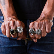 A model's hand wearing the heavy black onyx dragon claw brass ring to demonstrate its massive and impressive scale.