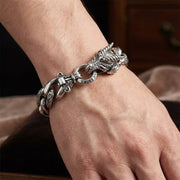 Dragon 925 sterling silver men's bracelet worn on wrist showing detailed dragon head clasp and curb chain links