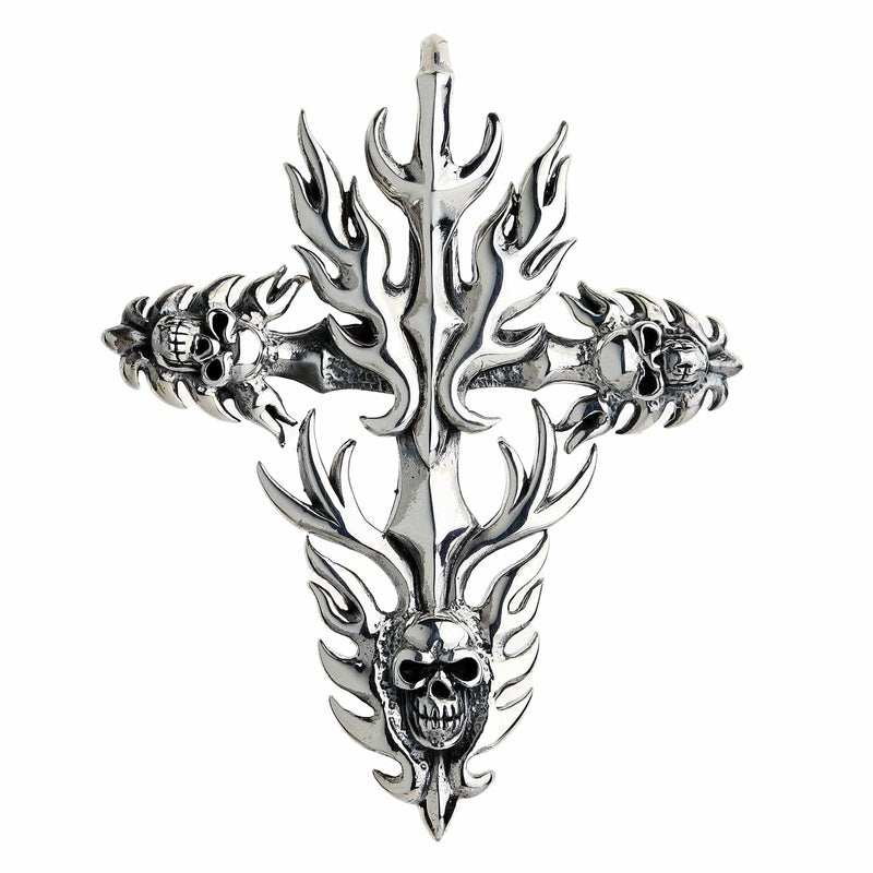 Front view of a silver cross pendant with radiating flames and detailed skulls integrated into the arm ends and base.