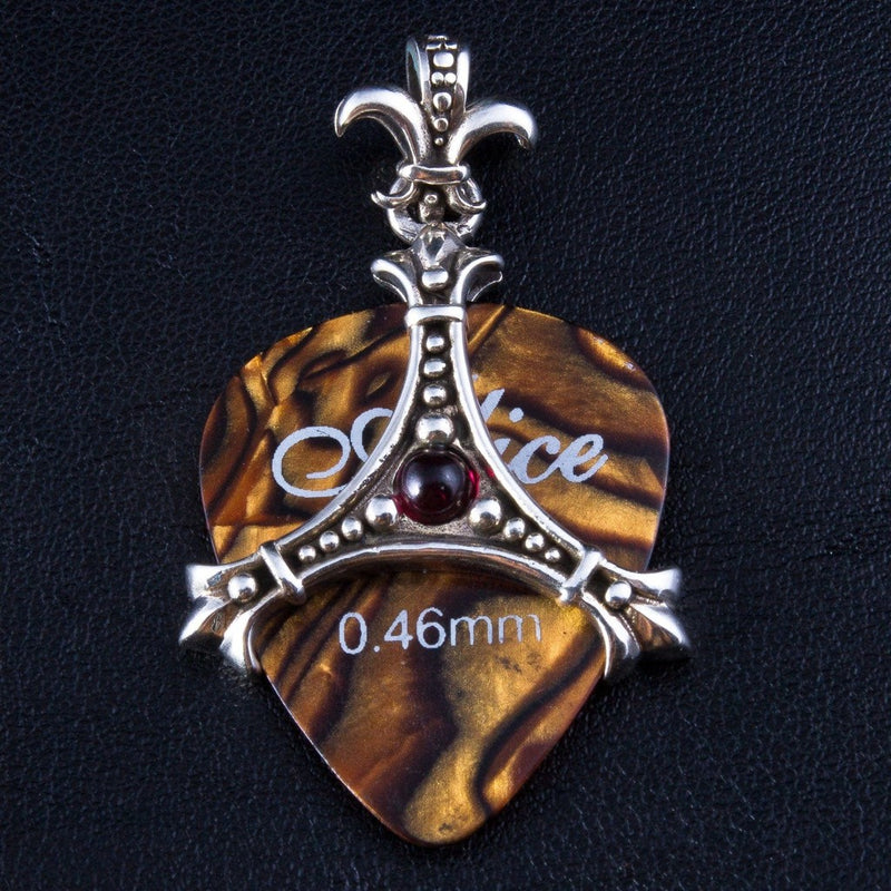 Front view of 925 sterling silver fleur de lis guitar pick holder pendant with ruby red cabochon stone