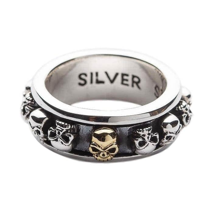 Front angle of the .925 sterling silver fidget ring highlighting the central gold skull on the spinning outer band.