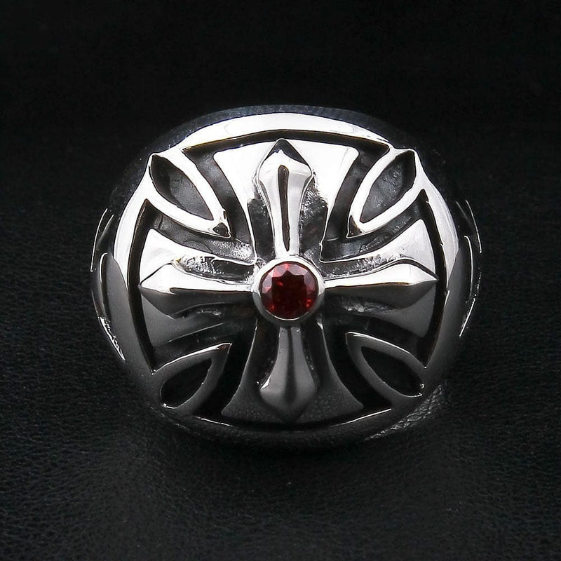 Gothic iron cross ring with deep red garnet stone top view showing polished silver finish