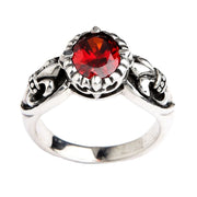 哥特式純銀戒指,配有閃亮的紅色石榴石和白色背景上的百合花設計