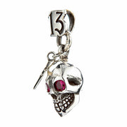 An angled view of the gothic skull and cross pendant, highlighting the red CZ eyes.