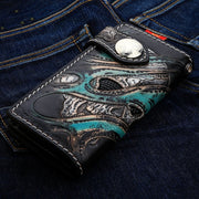 Green Devil Leather Biker Wallet angled view showing carved skull and teal flames