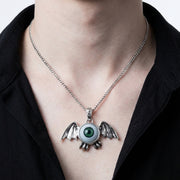 Green Eyeball Bat Pendant worn on neck showing scale