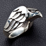 Side profile of handcrafted silver hawk ring highlighting sculpted wing feathers and smooth band