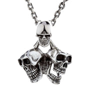 The heavy triple skull pendant shown on a sterling silver chain to represent it as a complete necklace.