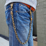 A man wearing the heavy lion head brass wallet chain with blue jeans, showing its 24-inch length.