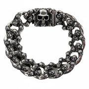 A front view of the heavy sterling silver multi-skull Cuban link bracelet with a large skull box clasp.