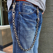 A man wearing the heavy sterling silver lion wallet chain with blue jeans, showing its 24-inch length.