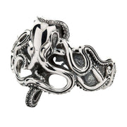 An angled view of the heavy sterling silver octopus bracelet, highlighting the detailed, writhing tentacles.
