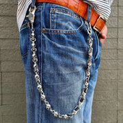 A heavy-duty sterling silver wallet chain made from individual skull links with an ornate gothic clasp.