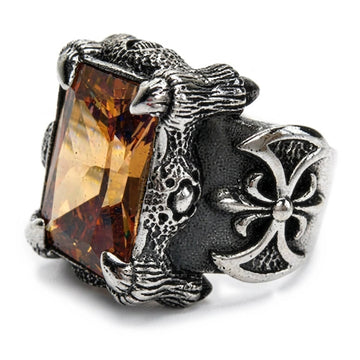 Imperial Topaz drakklo-ring i sterlingsilver i trekvartsvinkel, guldorange smaragdslipad sten hållen av silverklor