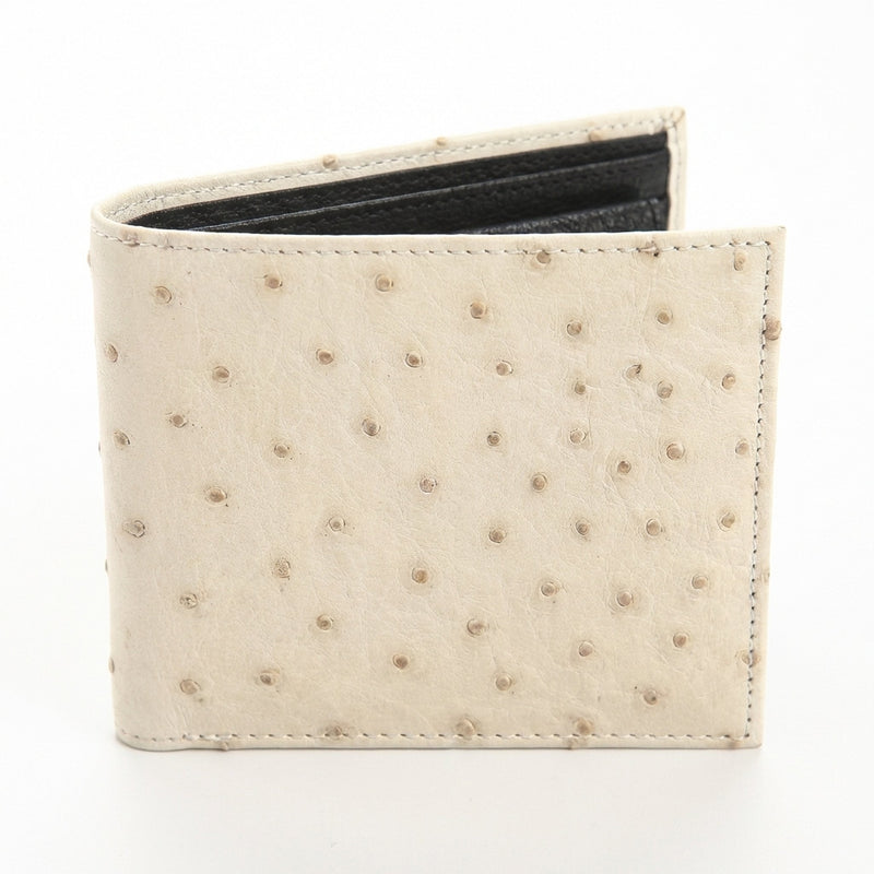 Ivory ostrich wallet standing at angle showing quill texture and black interior edge