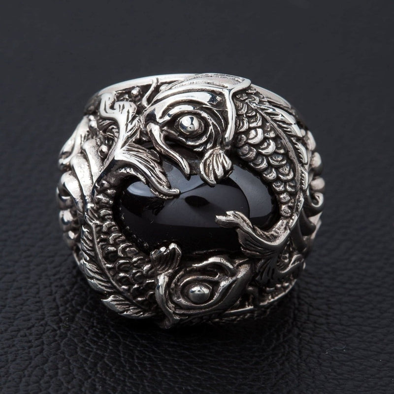 Sterling silver koi fish ring with black onyx cabochon front view showing twin fish design