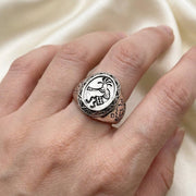 Kokopelli sterling silver adjustable ring being worn on a finger
