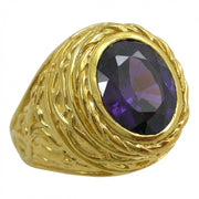 Gold bishop ring featuring a deep purple oval amethyst in a smooth bezel, surrounded by textured lily petal band details.