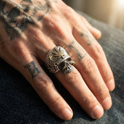 Marijuana leaf skull ring in 925 sterling silver with brass accent worn on tattooed hand