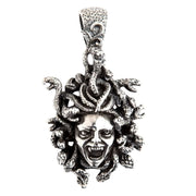 A large, handcrafted sterling silver Medusa head pendant featuring intricate snake hair and a furious, screaming expression.