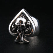 A men's solid sterling silver ring in the shape of the Ace of Spades with a skull and crossbones emblem.