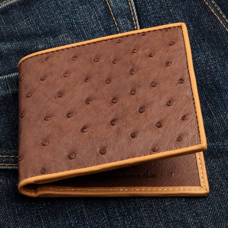 A men's bifold wallet in genuine brown ostrich leather, showing the distinctive full-quill pattern.