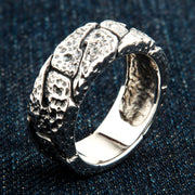 A men's sterling silver hammered ring with a rugged, pitted texture.