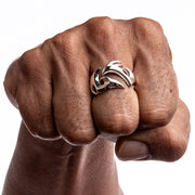 A men's solid sterling silver tribal tattoo ring with a bold, openwork design.