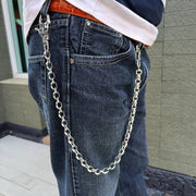 A man wearing the heavy silver biker wallet chain, showing how it hangs from the belt loop of his jeans.