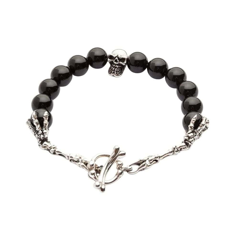 A full view of the men's black onyx skull bracelet, showing the sterling silver skull centerpiece and bone toggle clasp on a white background.