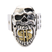 A front view of the men's sterling silver dollar sign skull ring, showing the gold dollar sign in its mouth and a clear crystal eye.