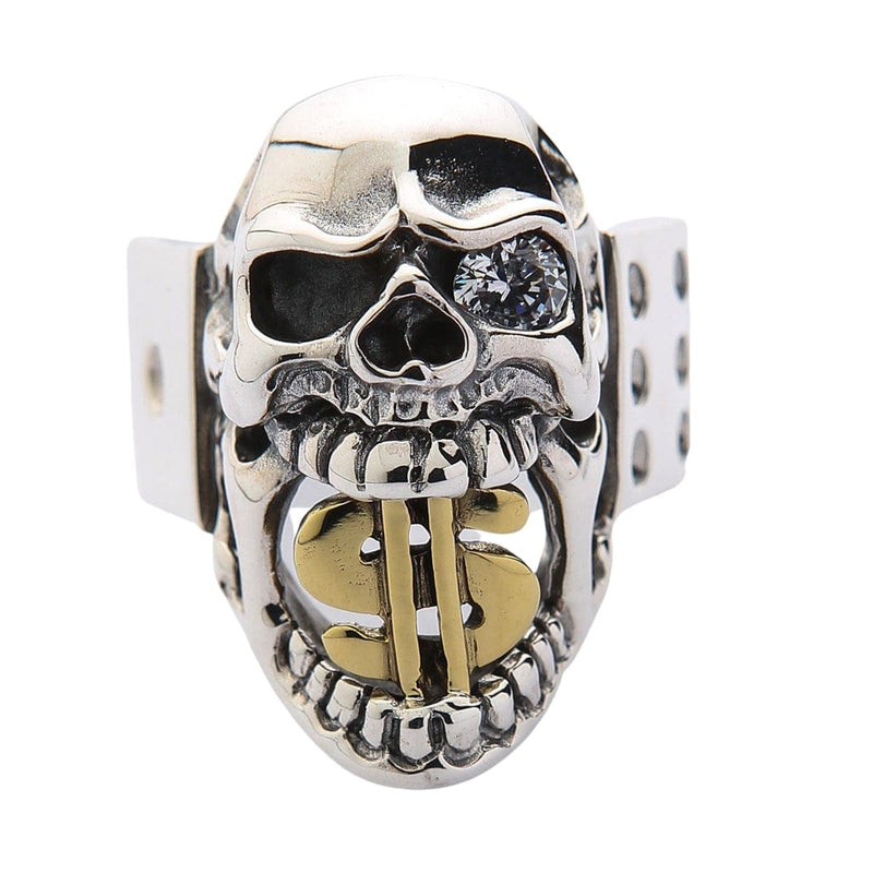 Una vista frontale dell'anello a teschio con segno di dollaro in argento sterling per uomo, che mostra il segno di dollaro in oro nella sua bocca e un occhio cristallo chiaro.