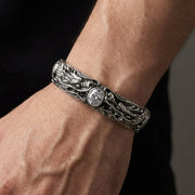 Man wearing solid silver double dragon cuff bracelet showing width and fit on wrist
