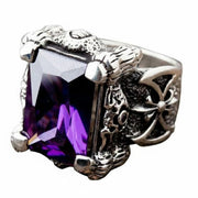 A powerful men's gothic ring featuring dragon claws holding a large, vibrant purple amethyst gemstone.