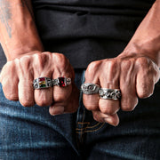 A man's hand wearing the sterling silver Lion of Judah Rasta ring, showing its size and fit on the finger.