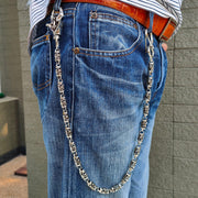 Lifestyle image of the silver wallet chain attached to blue denim jeans, showcasing the drape and length.