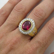 Men's ruby bishop ring worn on finger to demonstrate size and fit