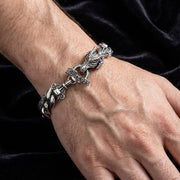 Men's sterling silver dragon T-bar bracelet worn on wrist, featuring detailed dragon head design and 925 hallmark clasp